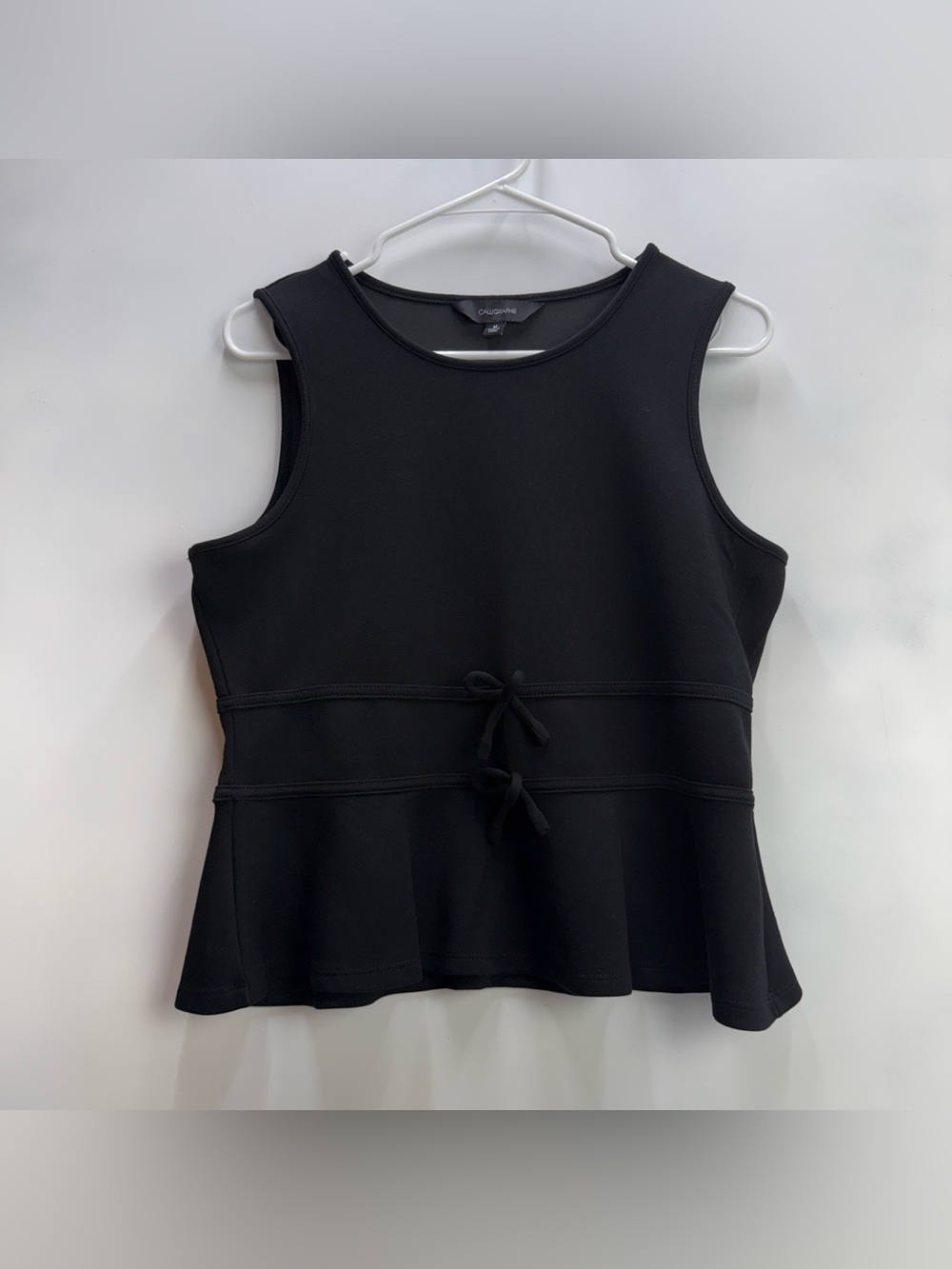 Calligraphie Women’s Black Blouse with Peplum Hem and Bows